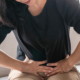 A lady experiencing abdominal pain from uterine cancer.