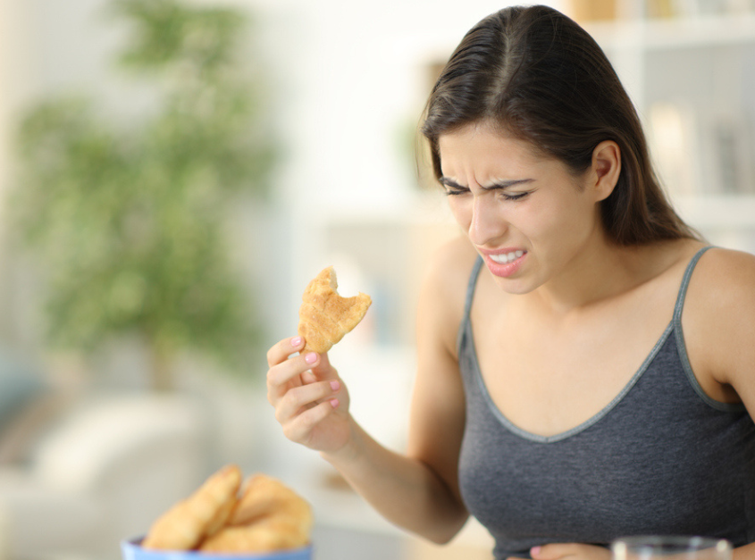 Woman Experiencing Pain While Eating